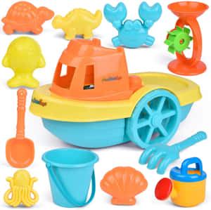 Caption: Fun Day At The Beach With Colorful Beach Toys Wallpaper