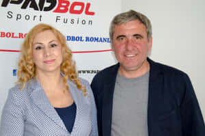 Caption: Gheorghe Hagi With Elisabeta Gherghisan In A Candid Moment Wallpaper