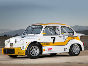 Caption: Graceful Fiat Abarth 1000 Berlina Corsa Revving Up Wallpaper