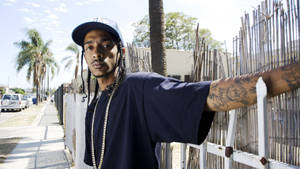 Caption: Grammy-winning Rapper Nipsey Hussle In Concert Wallpaper