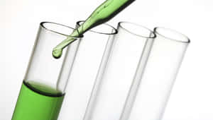 Caption: Green Chemistry Concept In A Laboratory Wallpaper