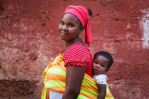 Caption: Heartwarming Scene Of A Mother And Child In Guinea-bissau Wallpaper