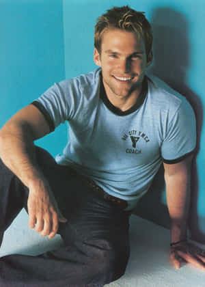 Caption: Hollywood Star Seann William Scott Smiles For The Camera Wallpaper