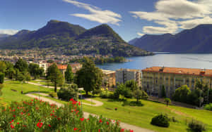 Caption: Idyllic View Of Lugano Lake Against A Dramatic Sky Wallpaper