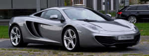 Caption: Impressive Mclaren Mp4-12c In Motion Wallpaper