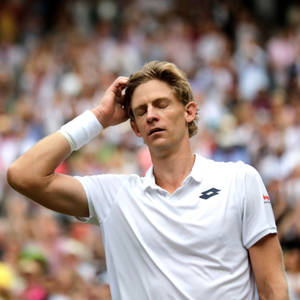 Caption: Intense Kevin Anderson With Eyes Closed In Thought Wallpaper