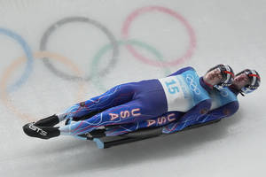 Caption: Intense Luge Doubles Action - Zachary Di Gregorio And Sean Hollander Wallpaper