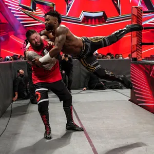 Caption: Intense Showdown Between Cedric Alexander And Kevin Owens At Wwe Raw Wallpaper