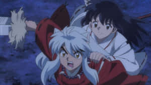 Caption: Inuyasha And Kagome's Enchanting Moment Wallpaper
