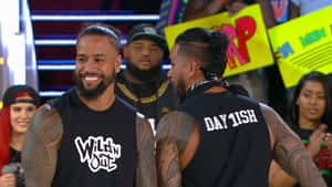 Caption: Jey Uso And Jimmy Uso In The Wwe Ring. Wallpaper