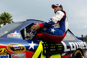 Caption: Jimmie Johnson Racing His Chevrolet At Full Speed Wallpaper