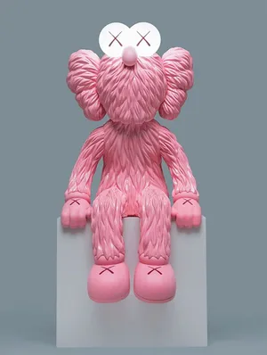 Caption: Kaws Bff Pink Artwork Displayed On A Wall Wallpaper