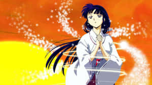 Caption: Kikyo, The Enchanting Priestess In A Contemplative Moment. Wallpaper