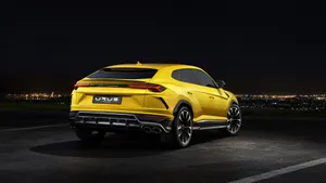Caption: Lamborghini Urus - The Ultimate Luxury Suv In Action Wallpaper