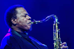 Caption: Legendary Jazz Musician Wayne Shorter On Stage Wallpaper