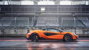 Caption: Lightning-fast Mclaren 600lt In Action! Wallpaper