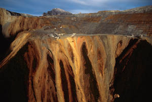 Caption: Lustrous Gold Nuggets On Raw Quartz Wallpaper