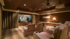 Caption: Luxurious Home Cinema Setup Wallpaper