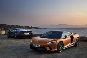 Caption: Luxurious Mclaren Gt In Motion Wallpaper