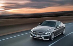 Caption: Luxurious Mercedes Benz C-class Amidst The Sunshine Wallpaper