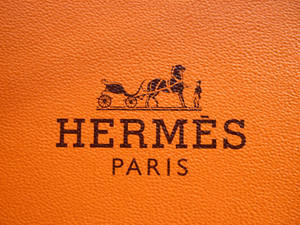 Caption: Magnificent Hermes Designer Logo Wallpaper