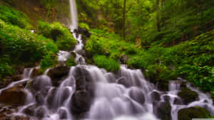 Caption: Majestic 4k Waterfall In Pristine Nature Wallpaper