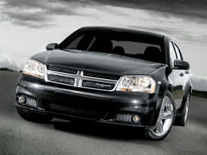 Caption: Majestic Blue Dodge Avenger At Sunset Wallpaper