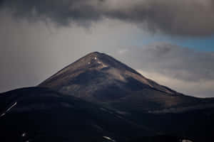 Caption: Majestic Dark Mountain Landscape Wallpaper