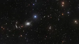Caption: Majestic Elliptical Galaxy In Space Wallpaper