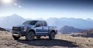 Caption: Majestic Ford Raptor Exploring Wild Mountain Terrains Wallpaper
