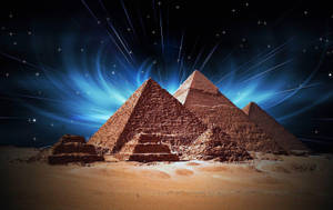 Caption: Majestic Illumination Of Cairo Pyramids At Night Wallpaper