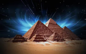 Caption: Majestic Illumination Of Cairo Pyramids At Night Wallpaper