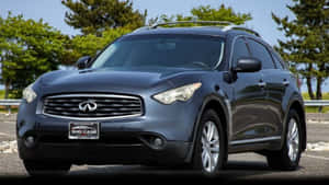 Caption: Majestic Infiniti Fx35 In Nature's Backdrop Wallpaper