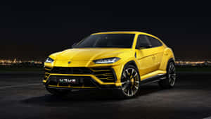 Caption: Majestic Lamborghini Urus On The Road Wallpaper