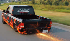 Caption: Majestic Low Truck On Highway Wallpaper