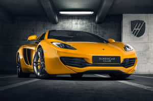 Caption: Majestic Mclaren Mp4-12c Racing Beast, Unleashing Pure Power On The Track Wallpaper