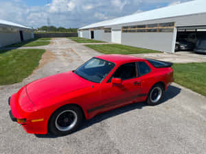 Caption: Majestic Red Porsche 944 In Full Display Wallpaper