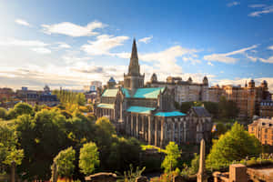 Caption: Majestic Scenery Of Glasgow City At Dusk Wallpaper