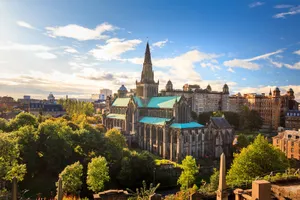 Caption: Majestic Scenery Of Glasgow City At Dusk Wallpaper
