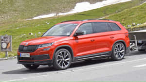 Caption: Majestic Skoda Kodiaq Suv In Motion Wallpaper