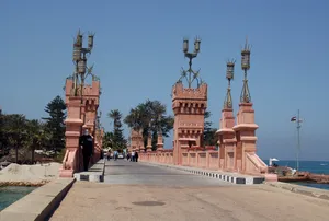 Caption: Majestic View Of Alexandria's El Montaza Bridge At Sunset Wallpaper