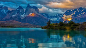 Caption: Majestic View Of Fitz Roy Near Lake In Argentina Wallpaper