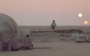 Caption: Majestic View Of Jedha City On A Starry Night Wallpaper