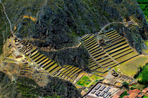 Caption: Majestic View Of Ollantaytambo Temple Hill Wallpaper