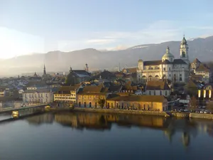 Caption: Majestic View Of Solothurn Cityscape Against Blue Sky Wallpaper