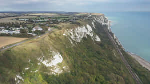 Caption: Majestic View Of The White Cliffs Of Dover Wallpaper