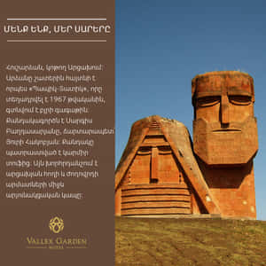 Caption: Majestic View Of We Are Our Mountains Monument Wallpaper