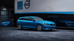 Caption: Majestic Volvo V60 On A Mountain Road Wallpaper