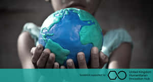 Caption: Making A Positive Impact - Humanitarian Efforts In Action Wallpaper