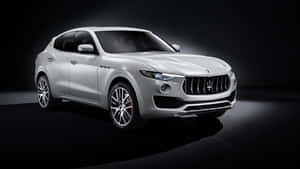 Caption: Maserati Levante In Golden Glory Wallpaper